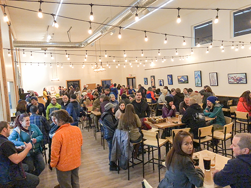 Warm interior of the Valdez Brewing taproom